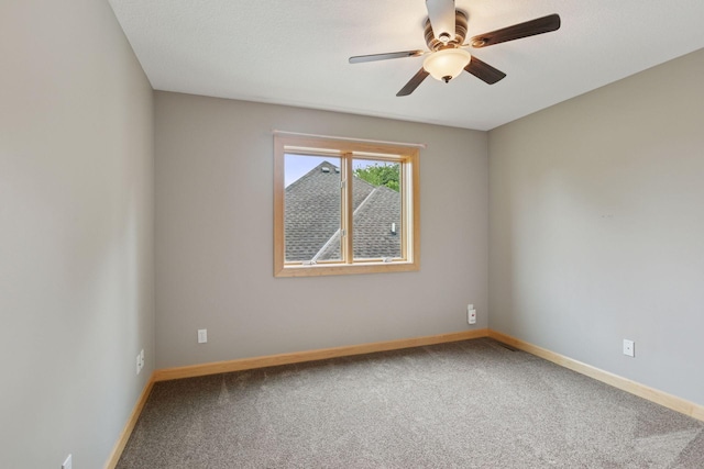 9885 Troy Ln N, Maple Grove, MN 55311 - empty room featuring carpet flooring, baseboards, and a ceiling fan