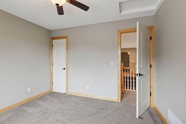 9885 Troy Ln N, Maple Grove, MN 55311 - unfurnished bedroom with carpet, baseboards, and ceiling fan