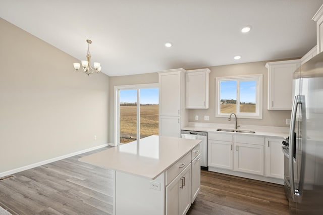451 Mallard St NE, Hanover, MN 55341 - kitchen with a sink, appliances with stainless steel finishes, light countertops, dark wood-style floors, and recessed lighting