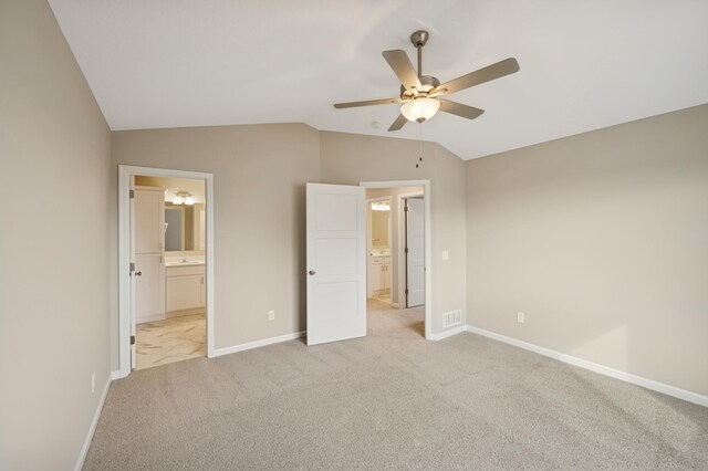 451 Mallard St NE, Hanover, MN 55341 - unfurnished bedroom featuring vaulted ceiling, light carpet, baseboards, ensuite bath, and a ceiling fan