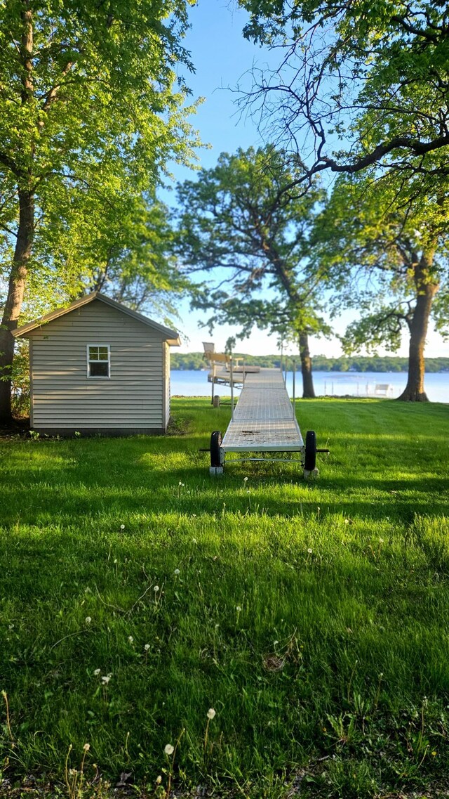 33798 Shady Oak Dr, Foster Twp, MN 56225 - view of green lawn with a water view and an outbuilding