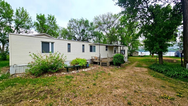 33798 Shady Oak Dr, Foster Twp, MN 56225 - back of house with a wooden deck