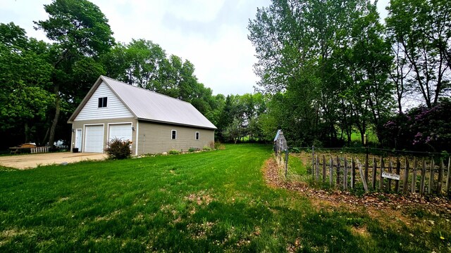 33798 Shady Oak Dr, Foster Twp, MN 56225 - view of yard with a garage and an outbuilding
