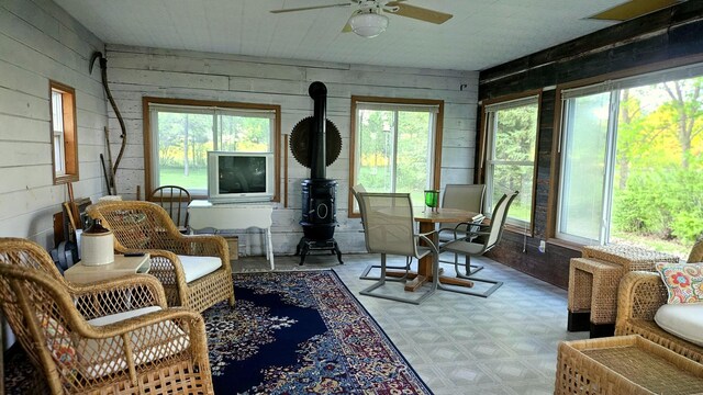 33798 Shady Oak Dr, Foster Twp, MN 56225 - sunroom / solarium with wood walls, plenty of natural light, and tile patterned floors