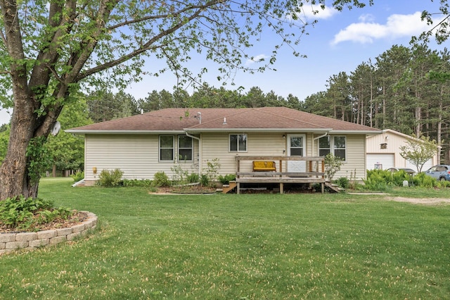 3364 85th Ave, Princeton, MN 55371 - back of property featuring a deck, a lawn, an outdoor structure, and a garage