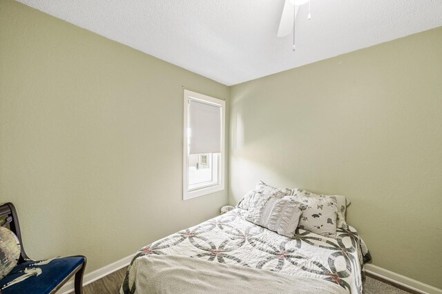 3364 85th Ave, Princeton, MN 55371 - bedroom featuring baseboards, ceiling fan, and wood finished floors