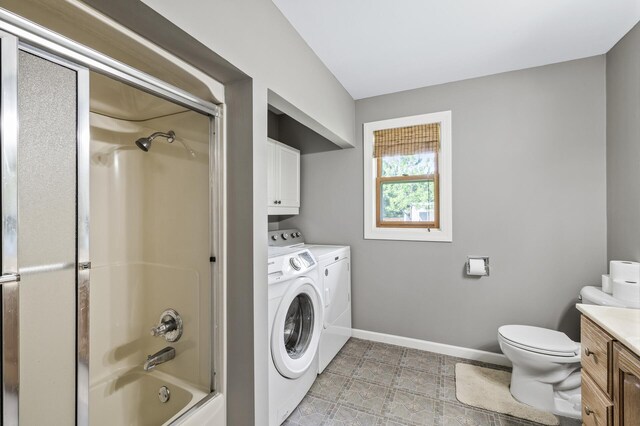 3364 85th Ave, Princeton, MN 55371 - bathroom featuring independent washer and dryer, toilet, tub / shower combination, vanity, and baseboards