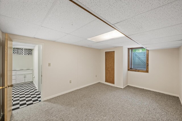3364 85th Ave, Princeton, MN 55371 - below grade area with baseboards, a paneled ceiling, and carpet