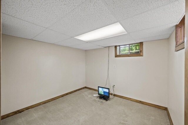 3364 85th Ave, Princeton, MN 55371 - below grade area featuring carpet floors, baseboards, and a paneled ceiling