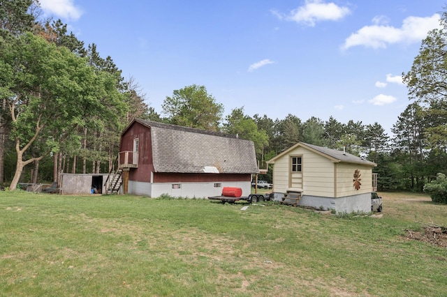 3364 85th Ave, Princeton, MN 55371 - view of green lawn with stairway, view of wooded area, and an outbuilding