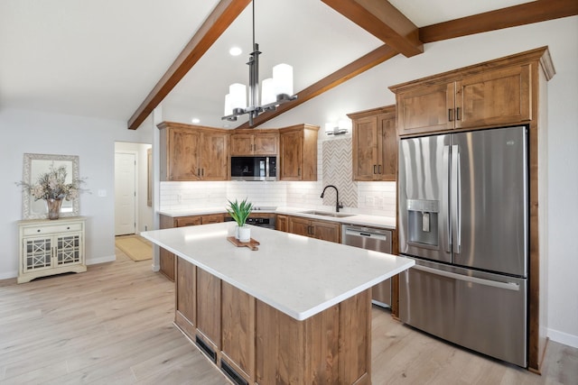 67854 217th St, Darwin, MN 55324 - kitchen featuring stainless steel appliances, a sink, decorative backsplash, light countertops, and recessed lighting