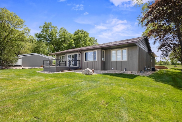67854 217th St, Darwin, MN 55324 - rear view of property with board and batten siding, a lawn, and a deck