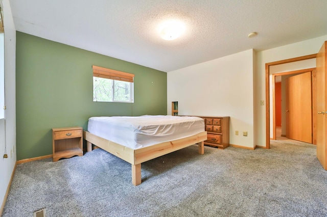 18917 Hartley Lake Rd, Brainerd, MN 56401 - carpeted bedroom featuring a textured ceiling and baseboards