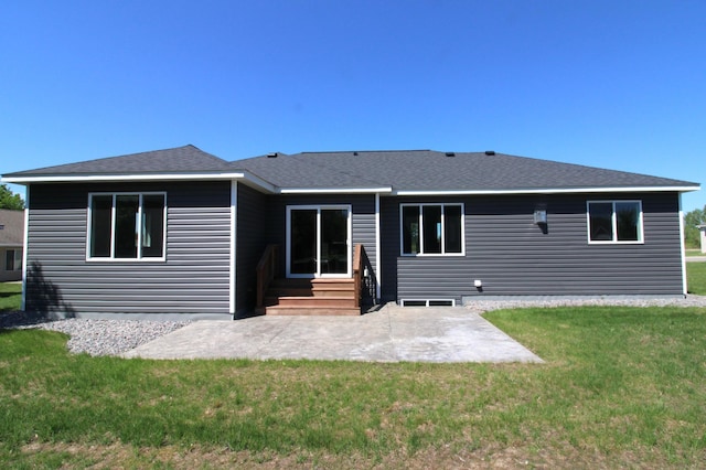 1707 17th St NW, Willmar, MN 56201 - rear view of property featuring a patio area, a yard, entry steps, and a shingled roof