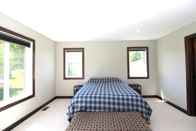 1707 17th St NW, Willmar, MN 56201 - bedroom with light colored carpet, baseboards, and recessed lighting
