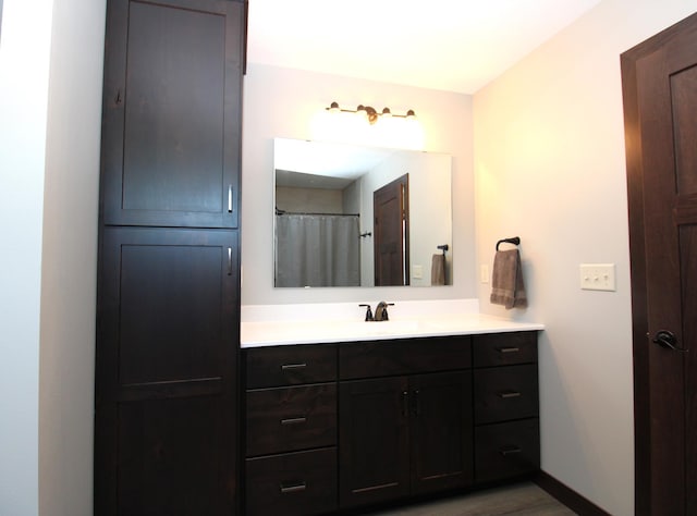 1707 17th St NW, Willmar, MN 56201 - bathroom featuring vanity and wood finished floors