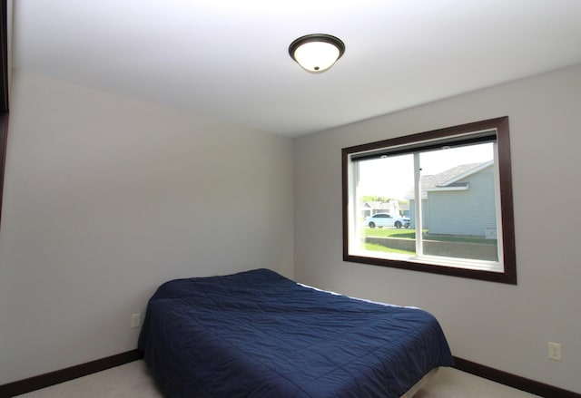 1707 17th St NW, Willmar, MN 56201 - bedroom featuring baseboards and light carpet