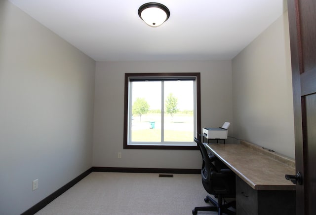 1707 17th St NW, Willmar, MN 56201 - home office featuring baseboards and light carpet