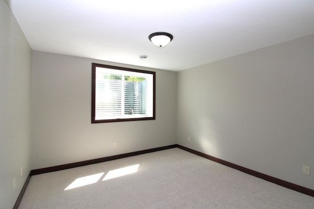 1707 17th St NW, Willmar, MN 56201 - empty room with baseboards and light carpet