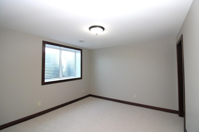1707 17th St NW, Willmar, MN 56201 - empty room with light colored carpet and baseboards