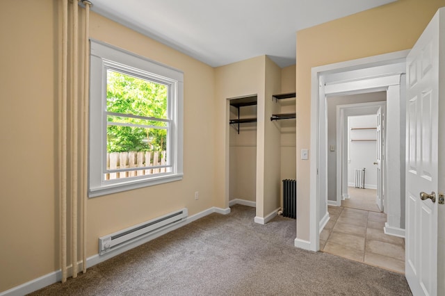 3545 Minnehaha Ave, Minneapolis, MN 55406 - unfurnished bedroom with a baseboard heating unit, carpet, baseboards, and a closet