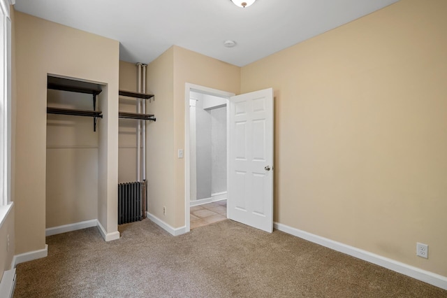 3545 Minnehaha Ave, Minneapolis, MN 55406 - unfurnished bedroom with carpet, baseboards, a closet, and baseboard heating