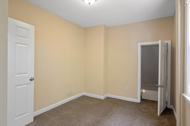 3545 Minnehaha Ave, Minneapolis, MN 55406 - unfurnished bedroom featuring dark colored carpet and baseboards