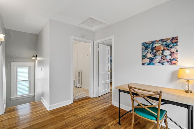 3545 Minnehaha Ave, Minneapolis, MN 55406 - office space with radiator, wood finished floors, baseboards, a baseboard heating unit, and attic access