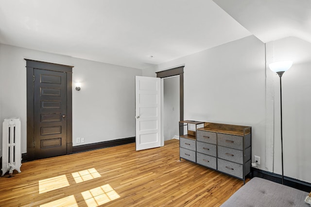 3545 Minnehaha Ave, Minneapolis, MN 55406 - unfurnished bedroom featuring radiator and light wood finished floors