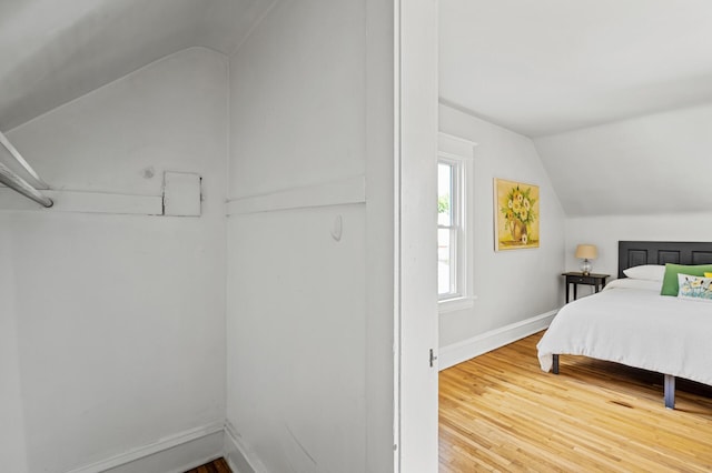 3545 Minnehaha Ave, Minneapolis, MN 55406 - bedroom with lofted ceiling, baseboards, and wood finished floors