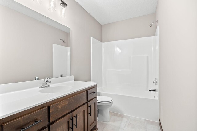 249 3rd St SW, Delano, MN 55328 - bathroom featuring vanity, toilet, bathing tub / shower combination, and tile patterned floors