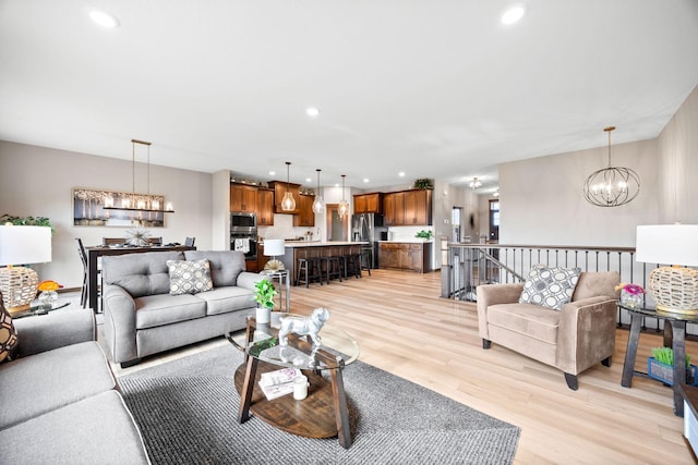 249 3rd St SW, Delano, MN 55328 - living area with a chandelier, light wood-type flooring, and recessed lighting
