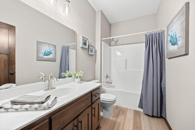 249 3rd St SW, Delano, MN 55328 - full bath featuring wood finished floors, vanity, toilet, and shower / tub combo with curtain