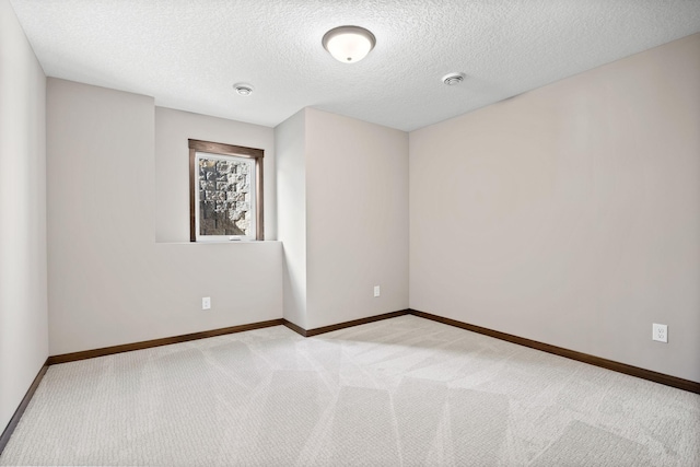 249 3rd St SW, Delano, MN 55328 - carpeted spare room with a textured ceiling, baseboards, and a smoke detector