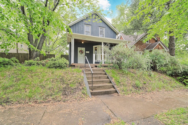 1066 Reaney Ave, Saint Paul, MN 55106 - view of front facade with covered porch and board and batten siding
