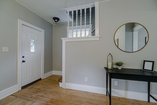 1066 Reaney Ave, Saint Paul, MN 55106 - entrance foyer with hardwood / wood-style flooring and baseboards