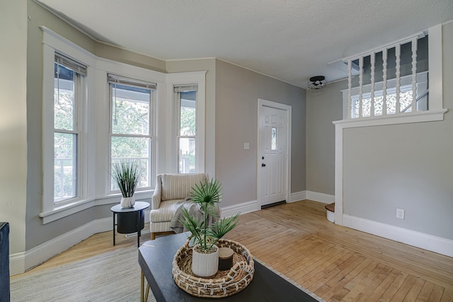 1066 Reaney Ave, Saint Paul, MN 55106 - living area featuring hardwood / wood-style floors and baseboards