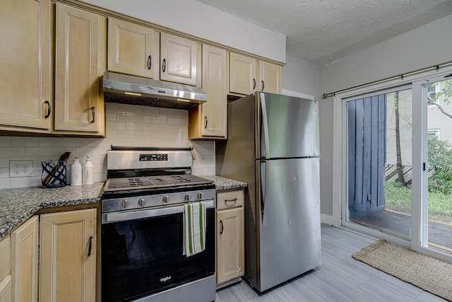 1066 Reaney Ave, Saint Paul, MN 55106 - kitchen with appliances with stainless steel finishes, under cabinet range hood, tasteful backsplash, light brown cabinets, and stone countertops