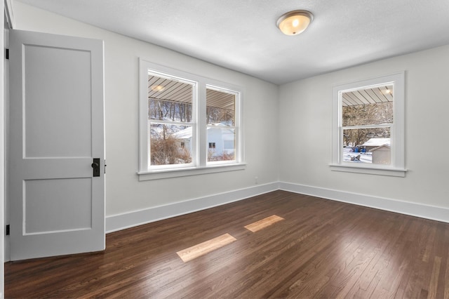 781 7th St, Red Wing, MN 55066 - spare room featuring plenty of natural light, dark wood-style flooring, and baseboards