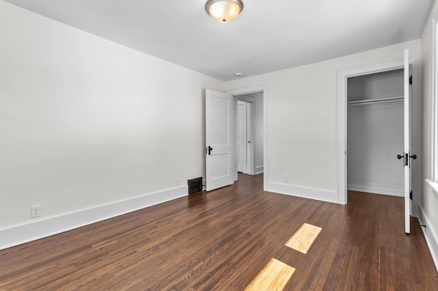 781 7th St, Red Wing, MN 55066 - unfurnished bedroom with dark wood-style floors, a closet, and baseboards