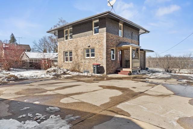 781 7th St, Red Wing, MN 55066 - snow covered house featuring brick siding