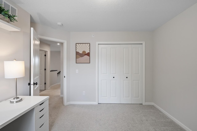 7602 Connie Ln, Inver Grove Heights, MN 55076 - unfurnished bedroom with light colored carpet, baseboards, and a closet
