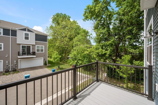7602 Connie Ln, Inver Grove Heights, MN 55076 - wooden deck with an attached garage and cooling unit