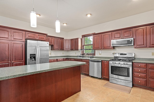 338 Aurora Ave, Saint Paul, MN 55103 - kitchen featuring appliances with stainless steel finishes, dark brown cabinets, decorative light fixtures, a sink, and dark countertops