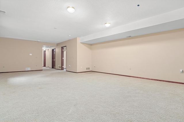 338 Aurora Ave, Saint Paul, MN 55103 - spare room with baseboards, light colored carpet, and a textured ceiling