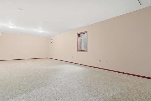 338 Aurora Ave, Saint Paul, MN 55103 - empty room featuring light carpet, baseboards, and a smoke detector