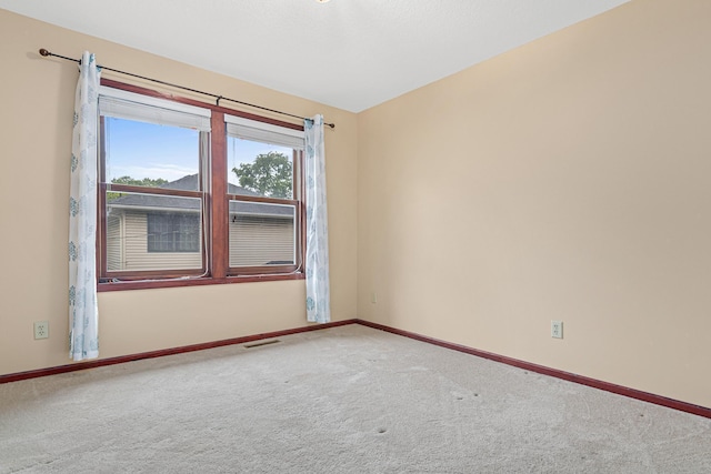 338 Aurora Ave, Saint Paul, MN 55103 - carpeted spare room with baseboards