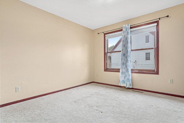 338 Aurora Ave, Saint Paul, MN 55103 - carpeted spare room featuring baseboards