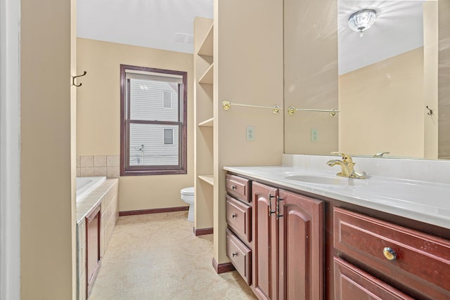 338 Aurora Ave, Saint Paul, MN 55103 - bathroom featuring vanity, toilet, tiled tub, and baseboards