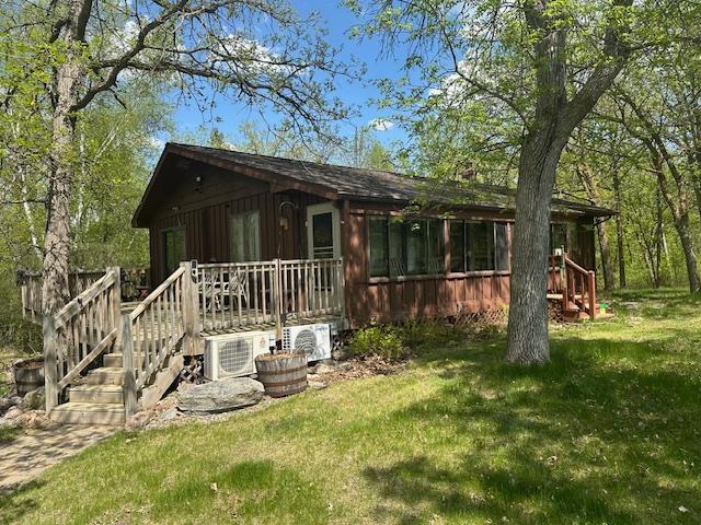 26722 Eisenmen Dr, Leonard, MN 56652 - back of property with a yard, a cooling unit, and a deck